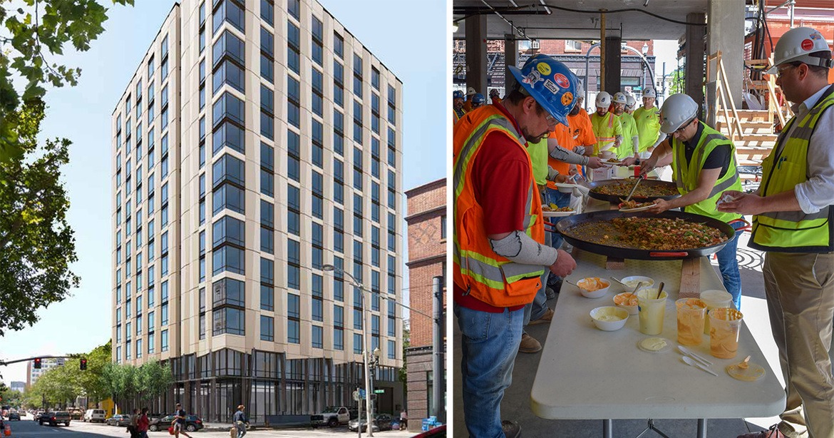 construction workers having lunch and new building