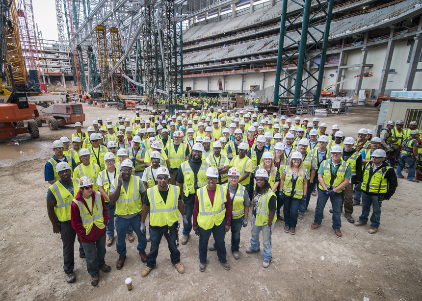 Group of construction workers in neon vests
