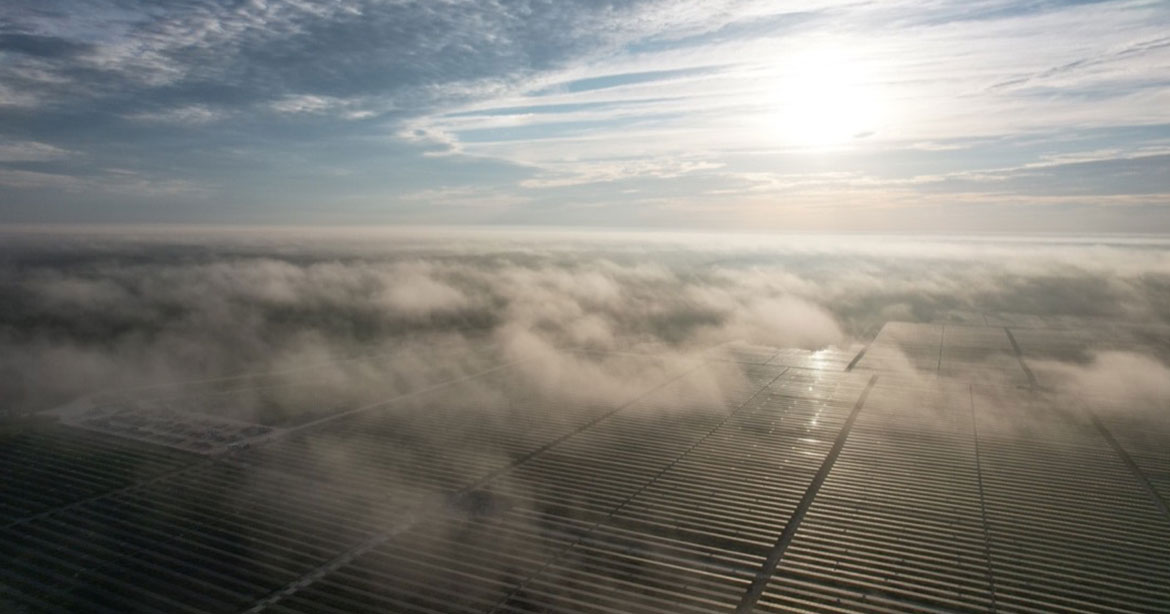 solar field through clouds