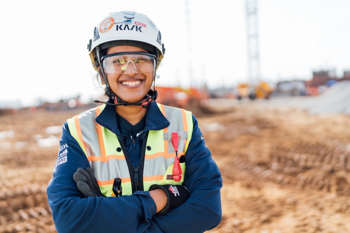 Woman in construction smiling 