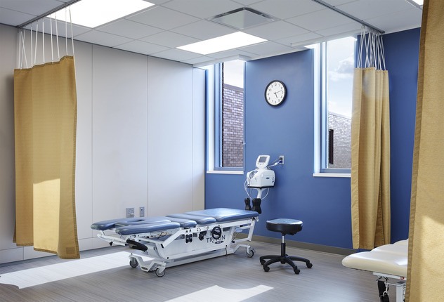 emergency room curtain area with bed