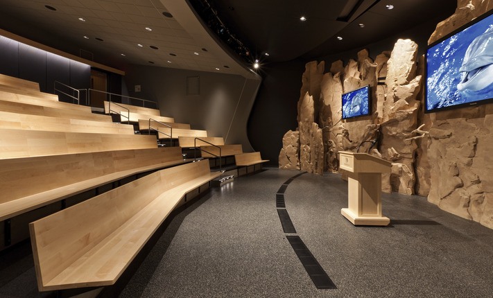 Minnesota Zoo presentation auditorium with benches and screens