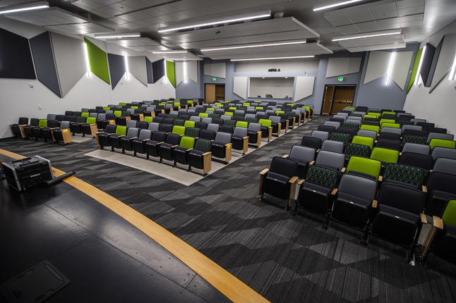 auditorium with green and grey seats newly constructed computational science hall