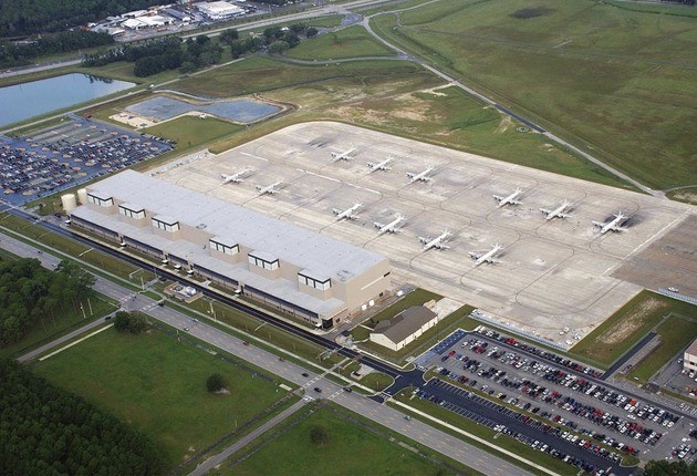 aerial of airport field and hangar