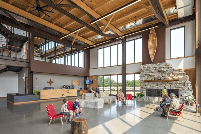 modern cedar and stone construction with large fireplace in lobby