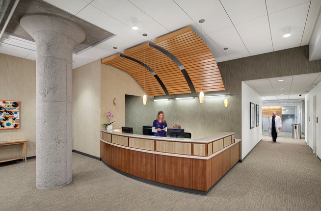 reception desk made of wood with concrete column