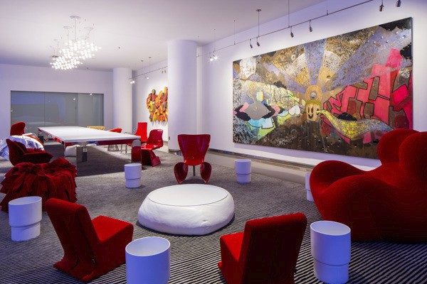 New hotel lobby at Radisson Blu with modern red chairs 