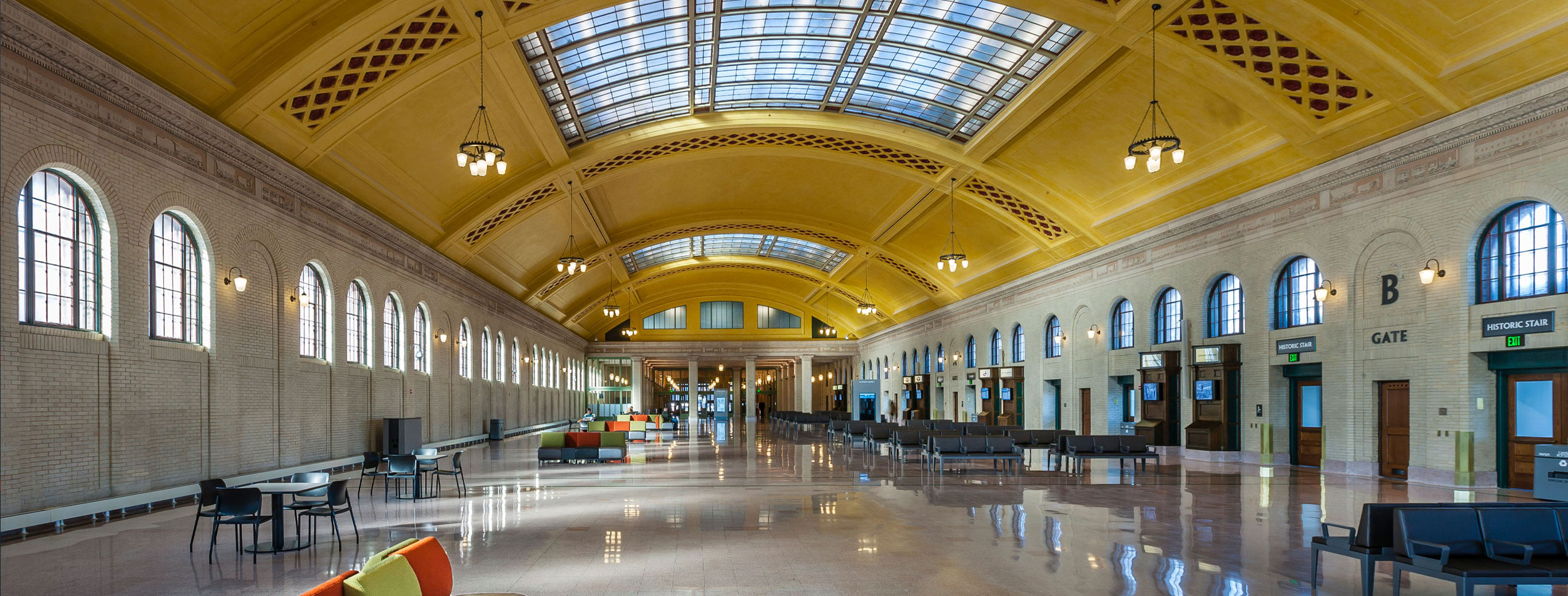 Inside of large depot with marble floors and large skylights