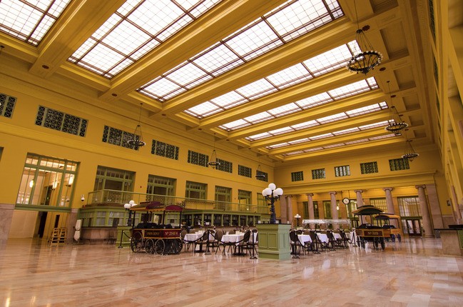 inside a depot with large skylights and yellow walls