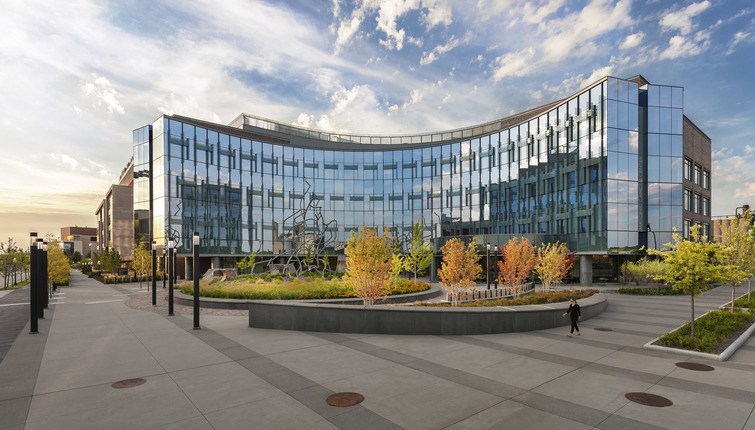 large glass building with landscaping
