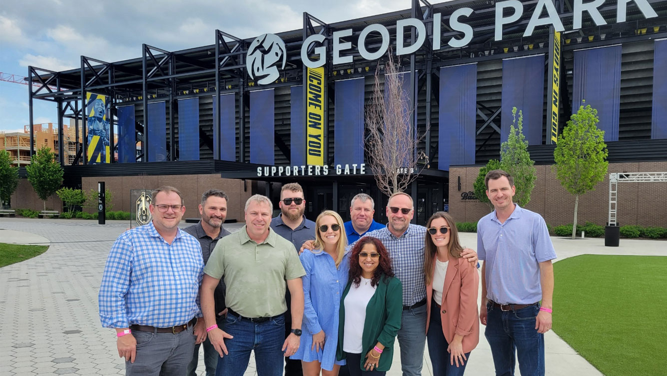 group in front of Geodis Park