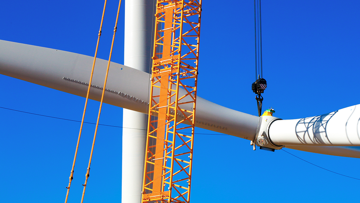 Wind turbine rotor being lifted into place