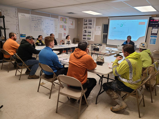 group of construction workers in a meeting room