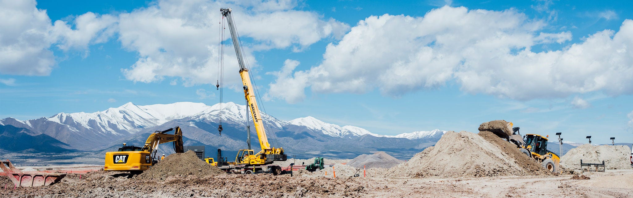 Heavy construction equipment at mountain worksite