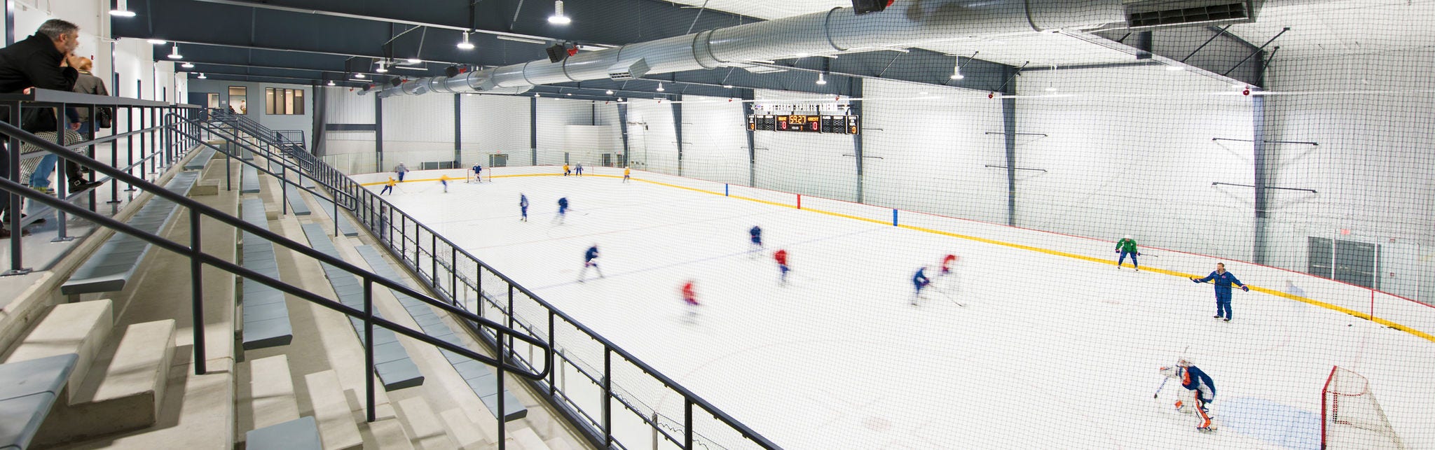 People playing hockey at Sports Arena