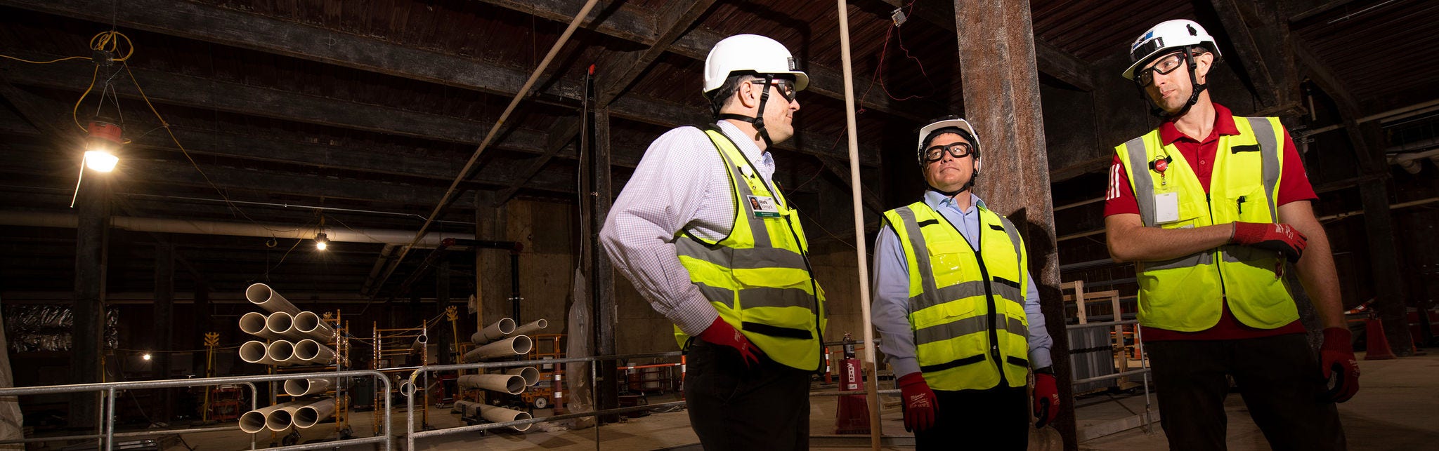Construction workers in safety gear onsite