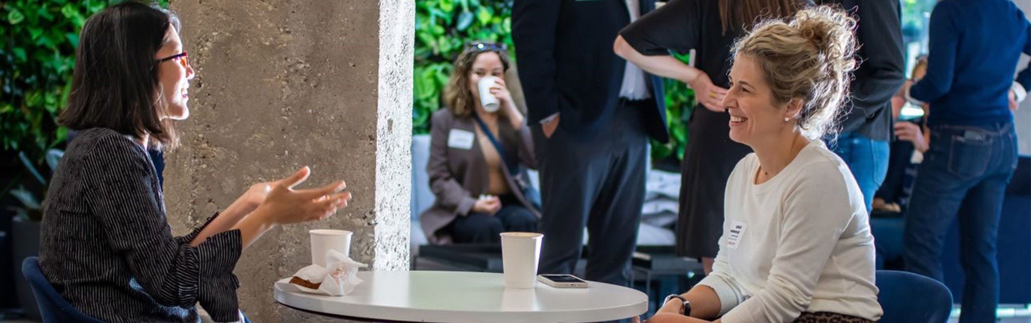 Casual business conversation in modern setting