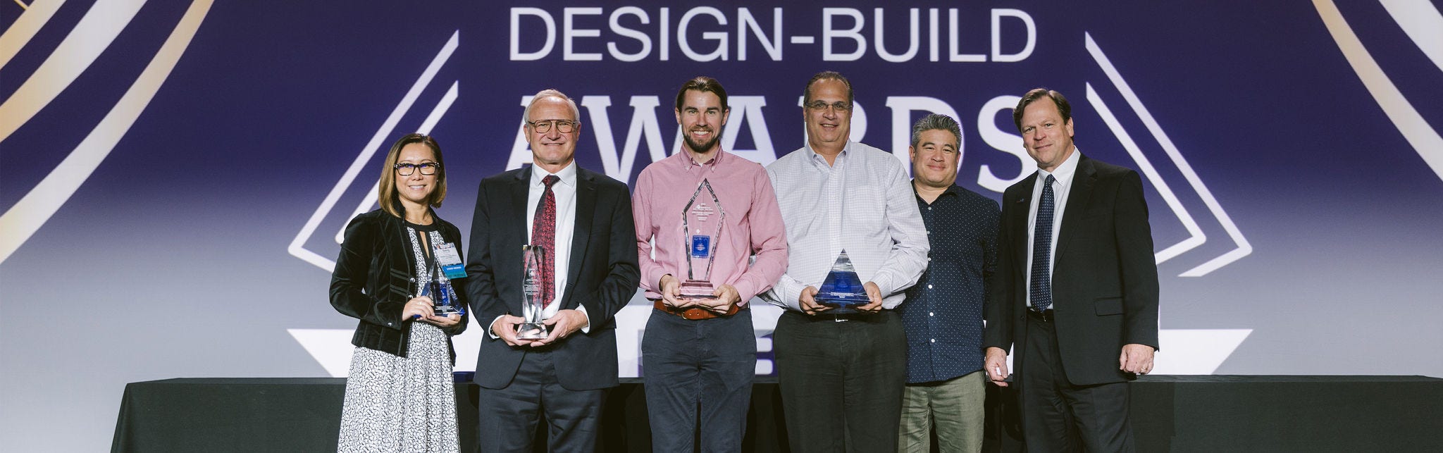 Group holding awards at design event