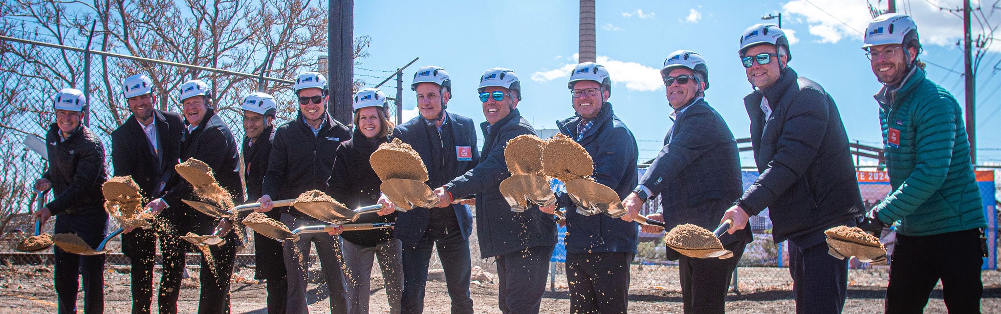 Group groundbreaking ceremony with shovels