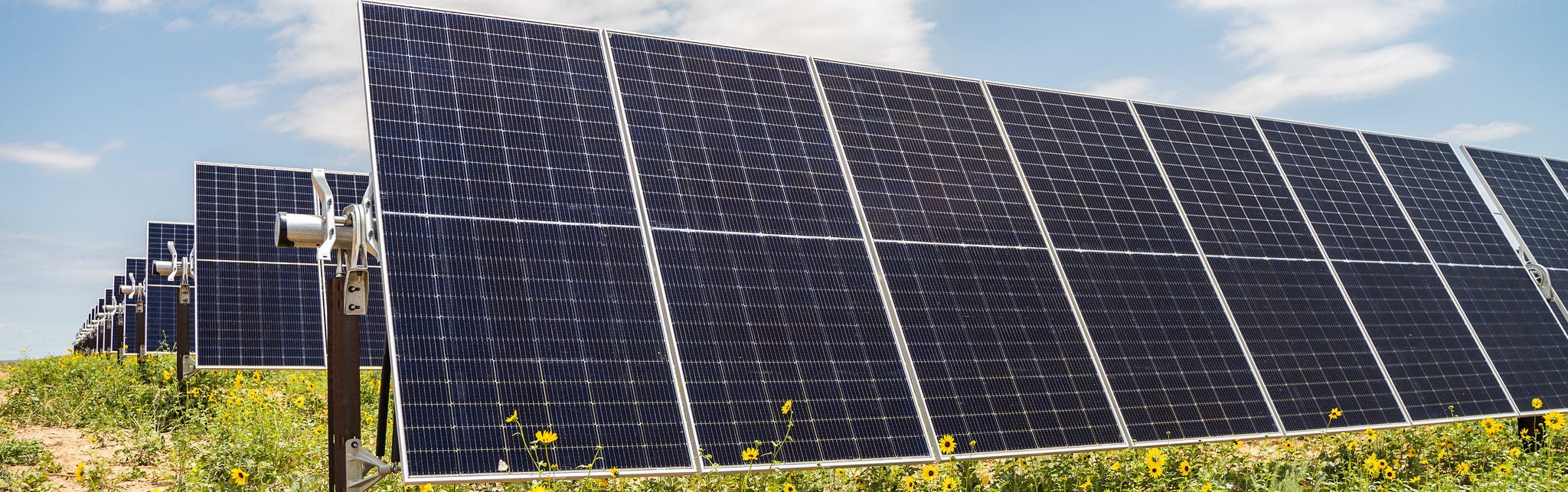 Solar panels in a sunny field