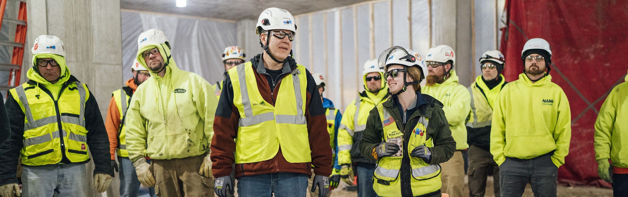 Construction workers in safety gear onsite