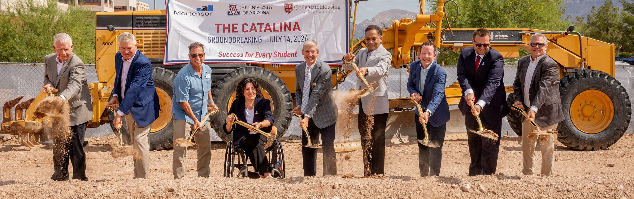 groundbreaking ceremony with shovels on construction site