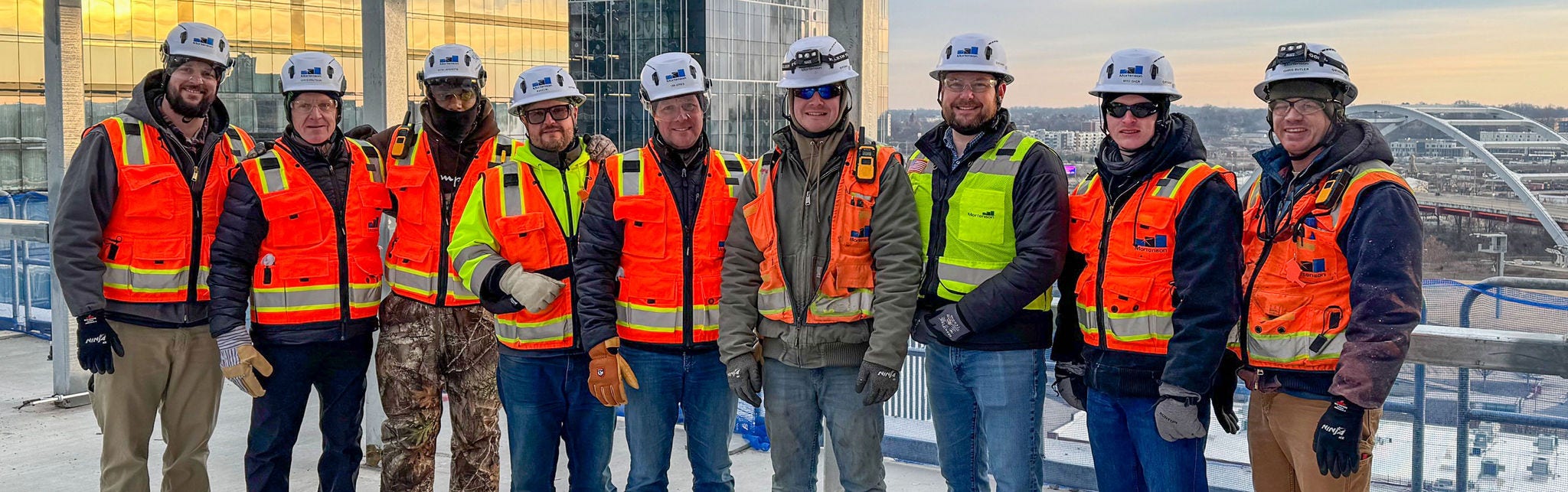 Construction team in safety gear at worksite