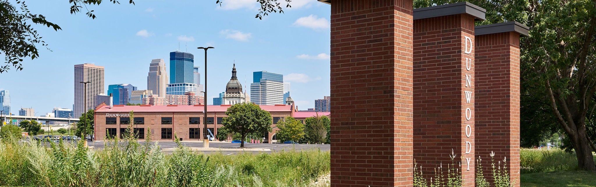 Dunwoody College of Technology campus with city skyline backdrop